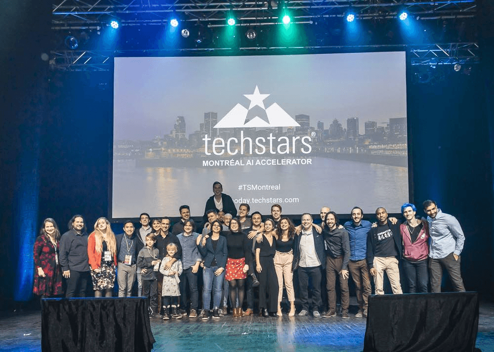 Corporate innovators attending Techstars accelerator demo day for startup scouting and partnership opportunities