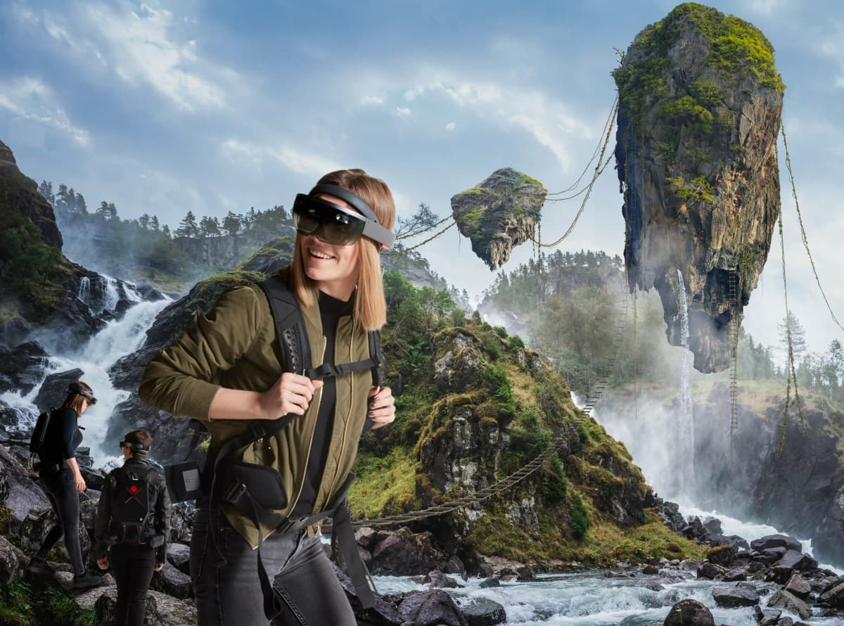 Campaign key visual: a player in a headset at a waterfall with floating rocks