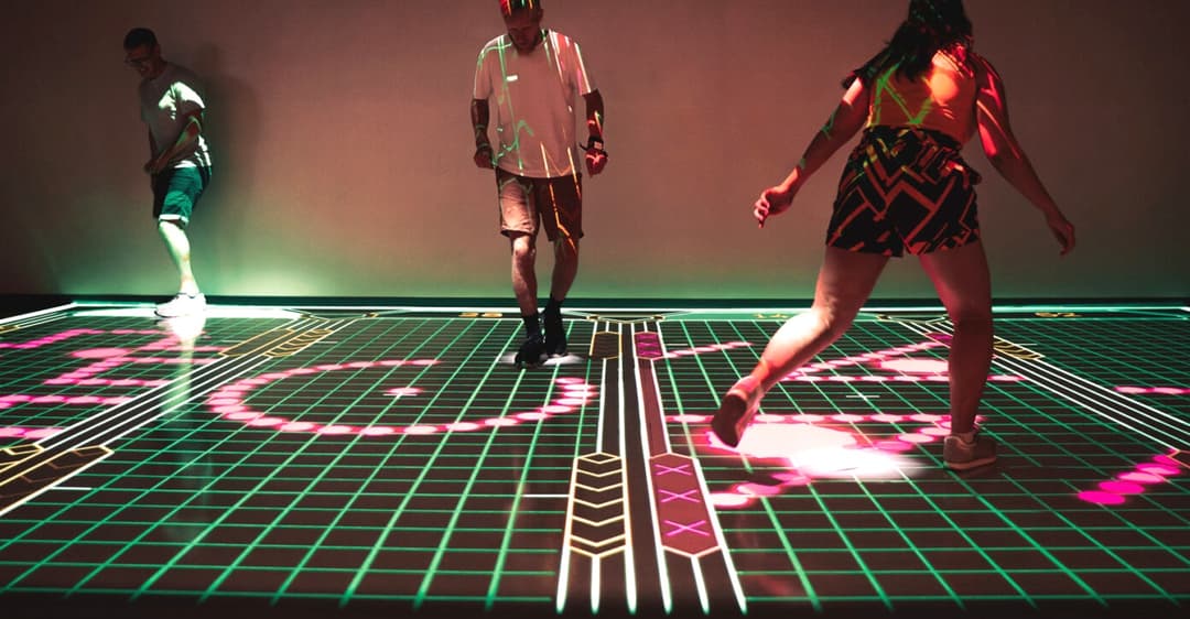 Players on an interactive light-up sports floor