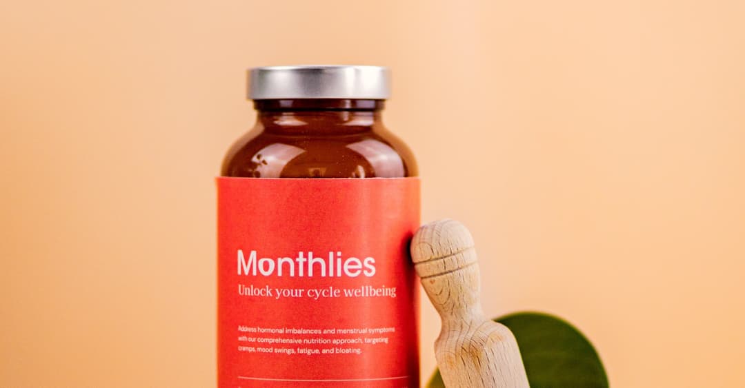 A jar of Monthlies menstrual care supplement